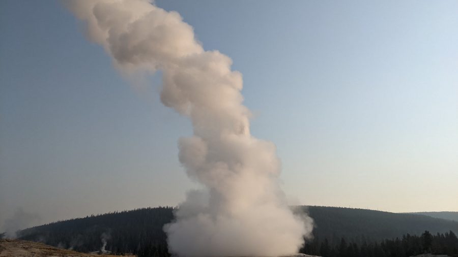 Old Faithful geyser in the early morning hours